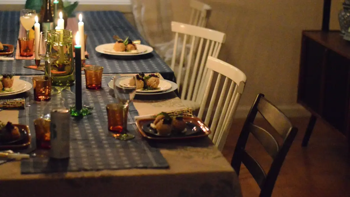 A formal dining table set for a meal.