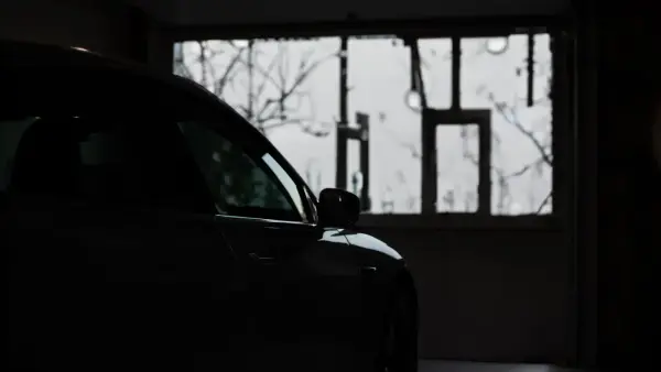 a car parked in a garage next to a window