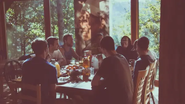 a group of people eating in a restaurant