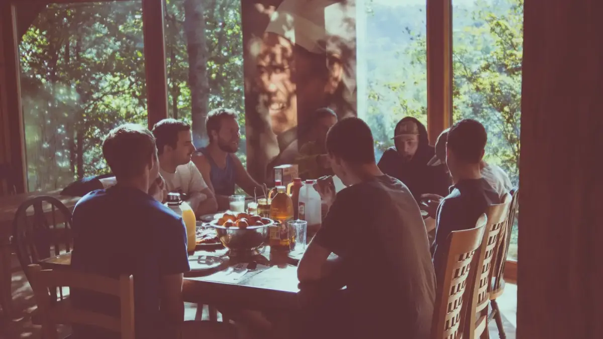 a group of people eating in a restaurant