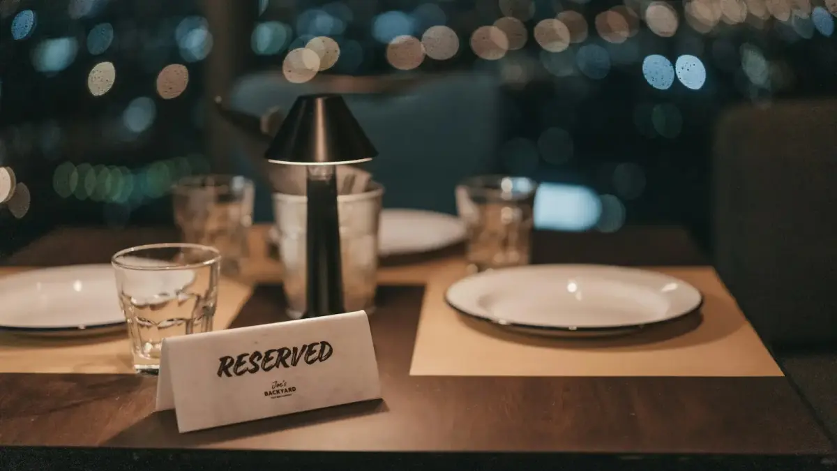 white ceramic plate on brown wooden table