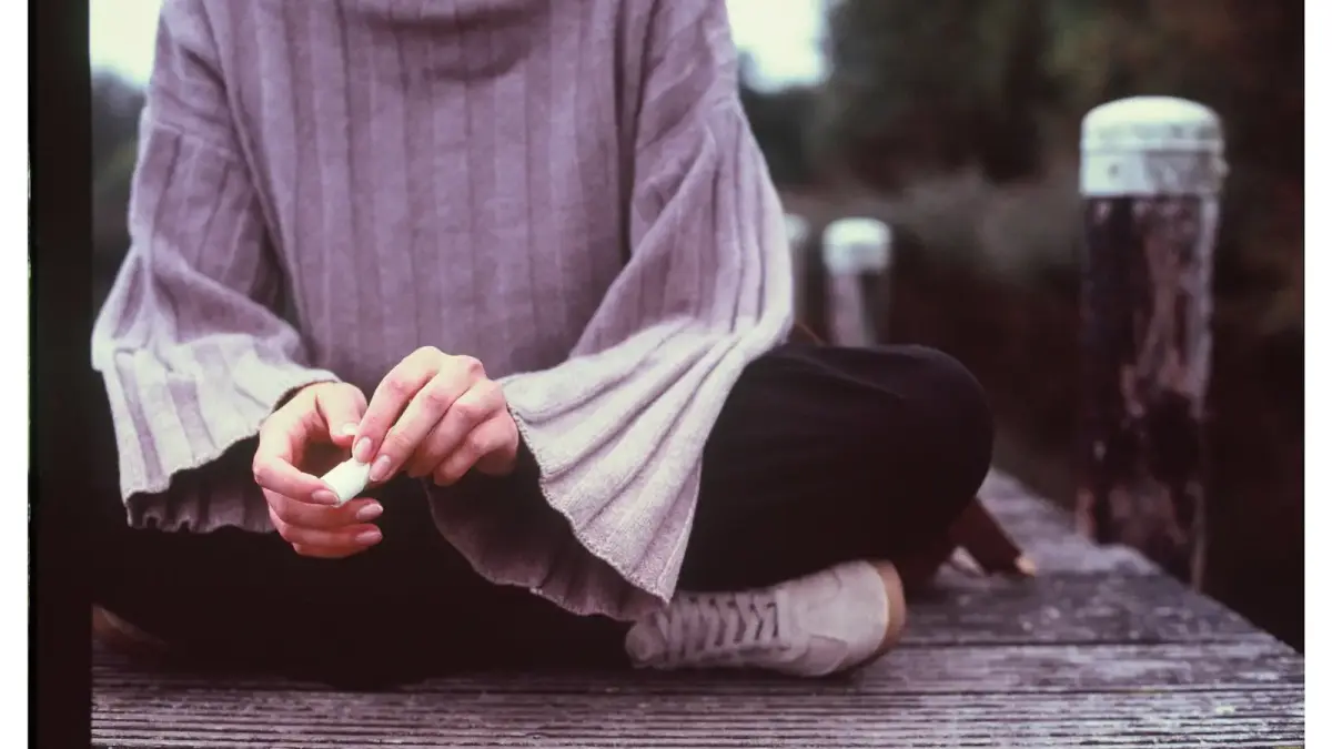 A person sitting quietly, lost in thought before speaking