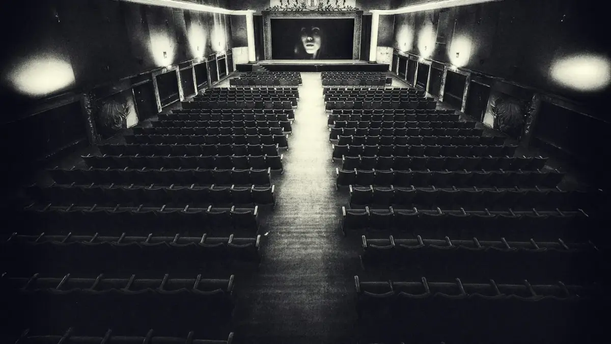 Empty vintage cinema hall with a screen