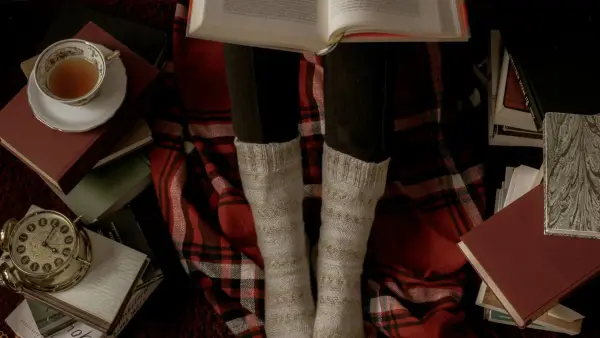 person in red and black plaid pants and white socks