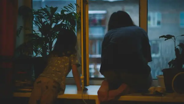 a person offering comfort and emotional support in a warm living room