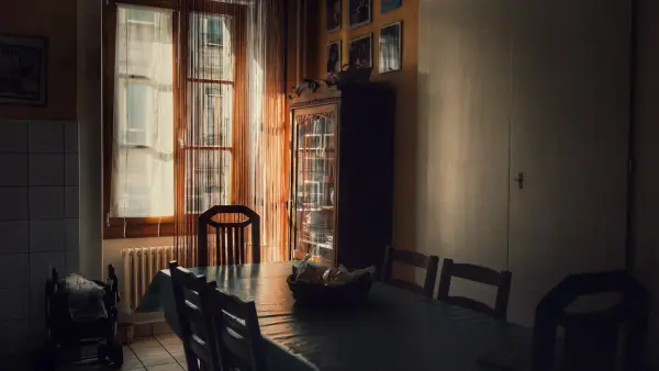 brown wooden dining table set near windows