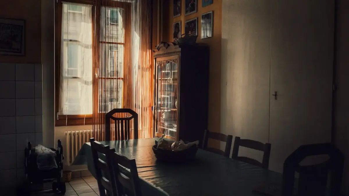brown wooden dining table set near windows