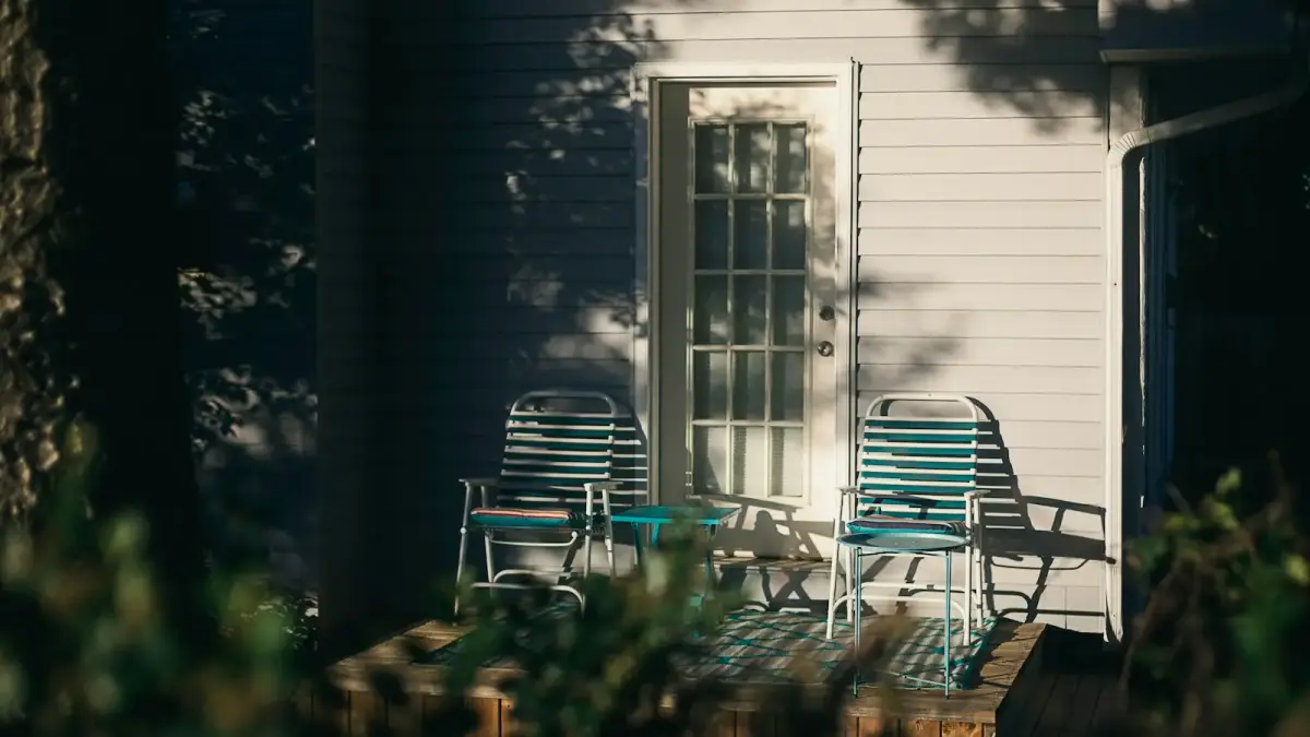 Two old friends sitting on porch chairs in the golden evening light