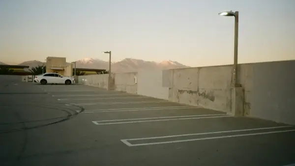 a white car parked in a parking lot