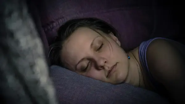 A dim bedroom at night, the quiet hours when the body will not rest