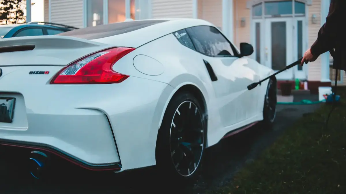 white porsche 911 parked near white house