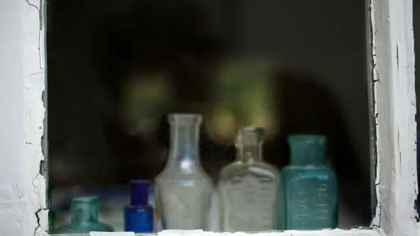 clear glass bottles on white table