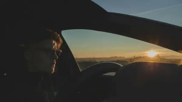 man driving car during daytime